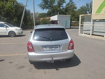 Унаа: Mazda 323: 2003 г., Кол менен иштөөчү, Бензин, Универсал — 4