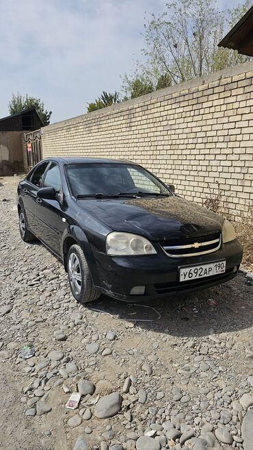 шевроле камаро цена: Черный седан Chevrolet Lacetti, представленный на фотографиях
