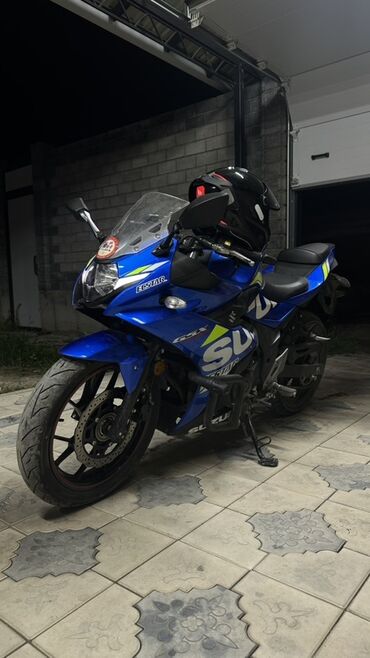 купить мотоцикл в рассрочку без банка: Мотоцикл Suzuki GSX-250R синего цвета с аэродинамическим обтекателем и