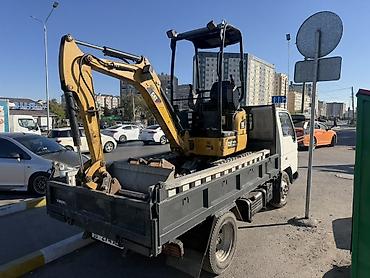 услуги экскаваторов: Услуги мини‑экскаватора CAT - Гусеничный мини‑экскаватор Caterpillar — 1