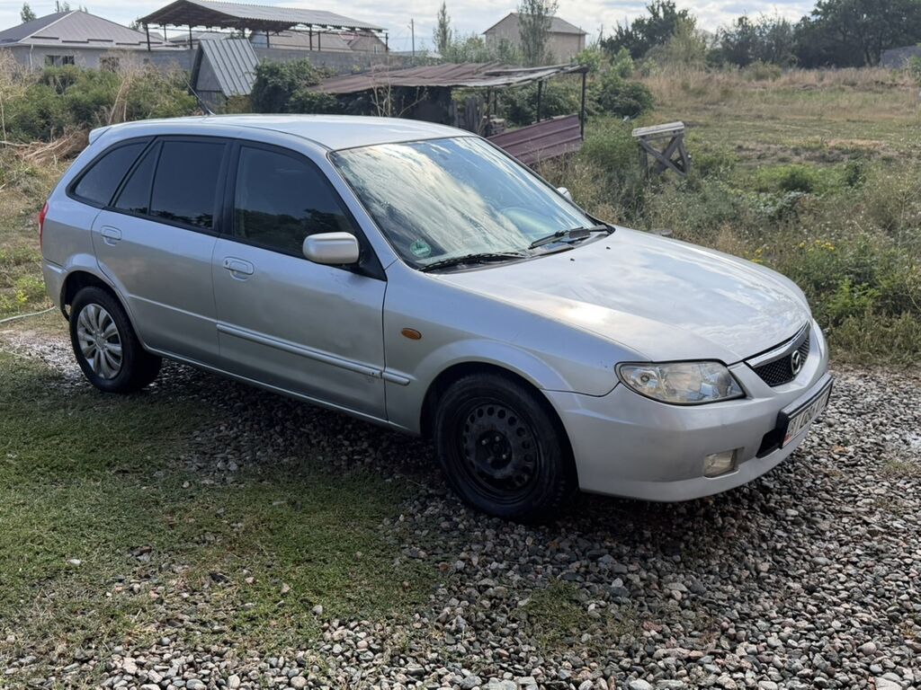 Mazda 323: 2003 г., 1.6 л, Механика, Бензин, Хэтчбэк: фото 1