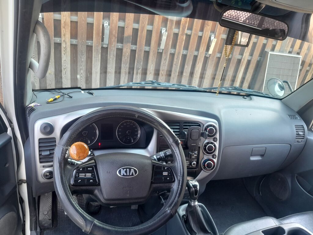 KIA Bongo III — легкий грузовик с открытым бортом. Основные: фото 8