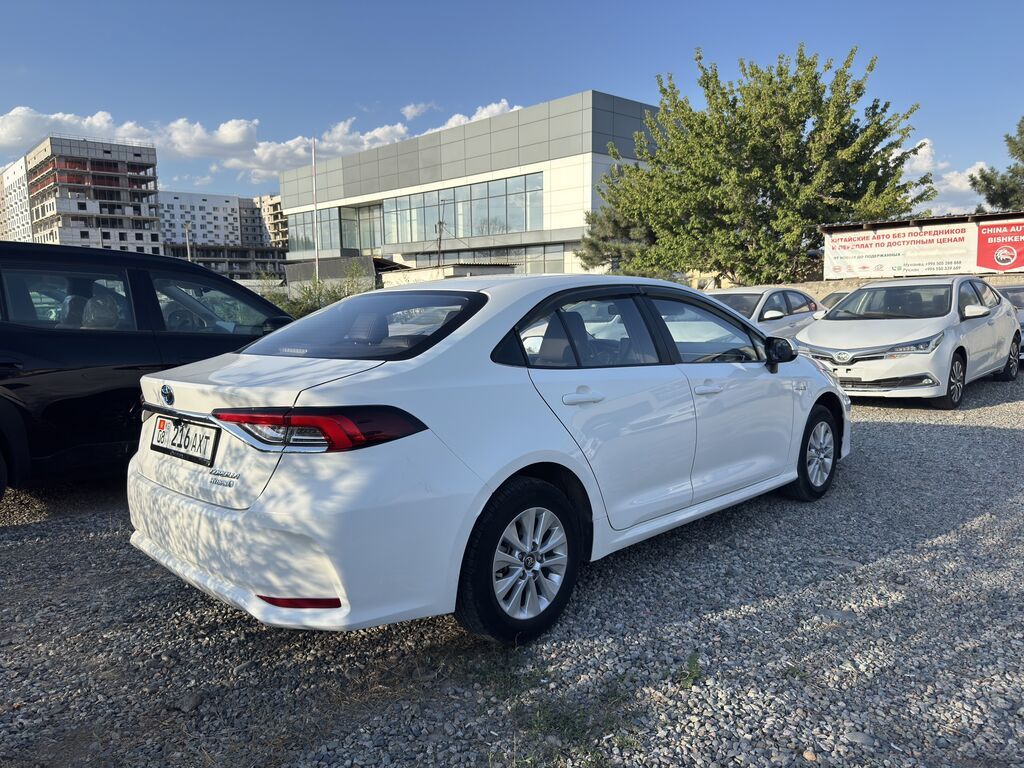 Toyota Corolla: 2021 г., 1.8 л, Автомат, Гибрид, Седан: фото 4