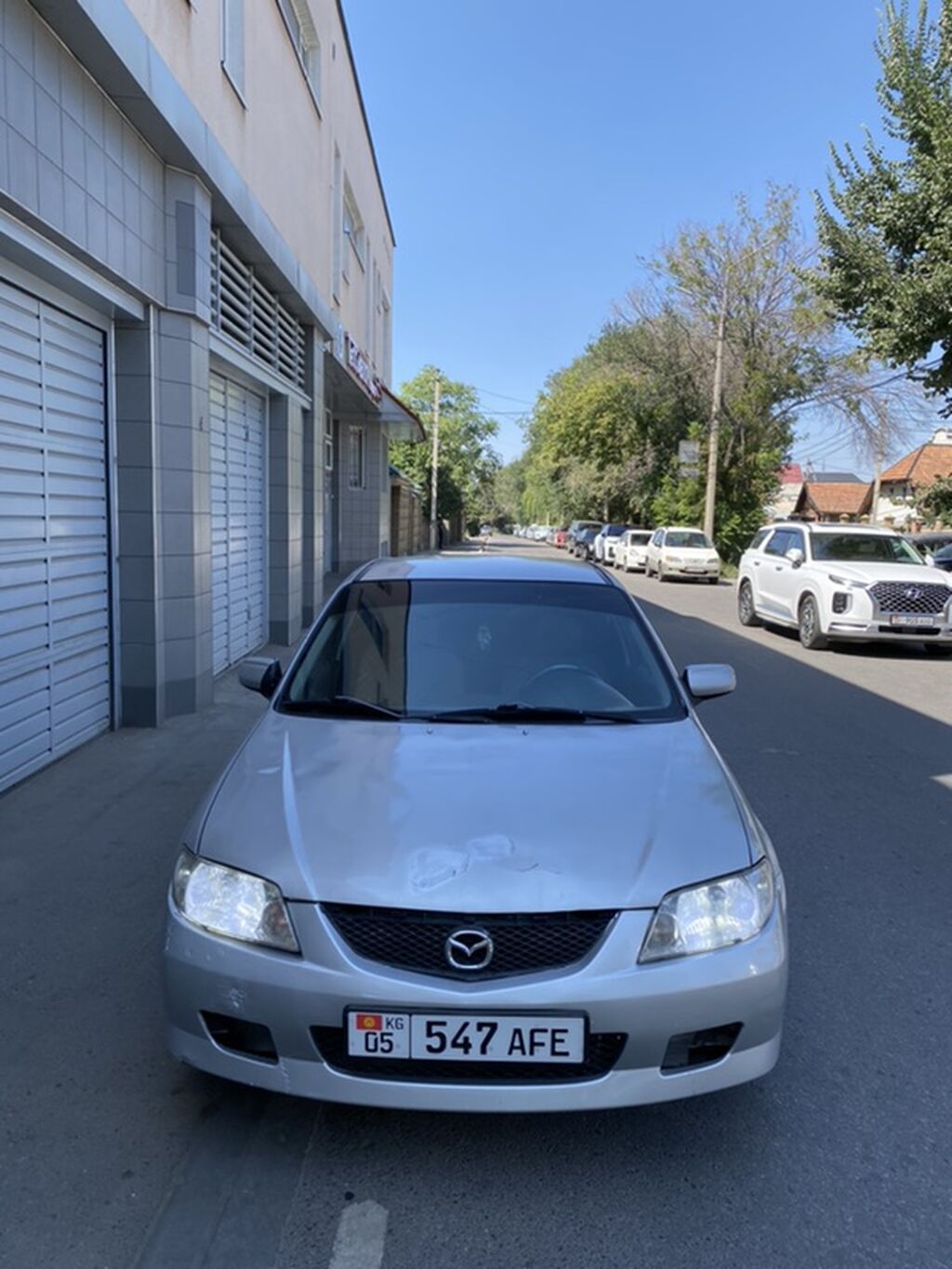 Mazda 323: 2002 г., Механика, Хэтчбэк: фото 4