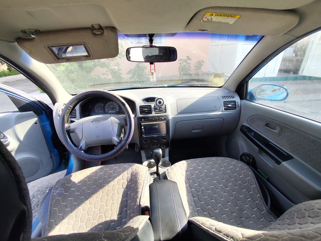 Kia Rio: 2003 г., 1.5 л, Автомат, Бензин, Универсал — фото 5