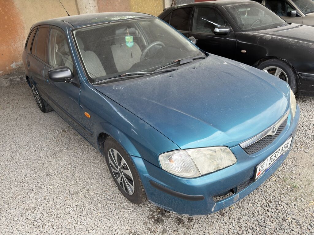 Mazda 323: 1999 г., 1.5 л, Механика, Бензин, Универсал: фото 2