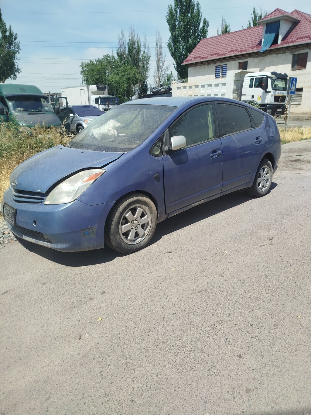 Toyota Prius (XW20), гибридный хэтчбек 5 дв. Основные характеристики: фото 2