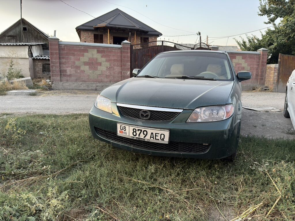 Mazda Protege: 2002 г., Седан: фото 3