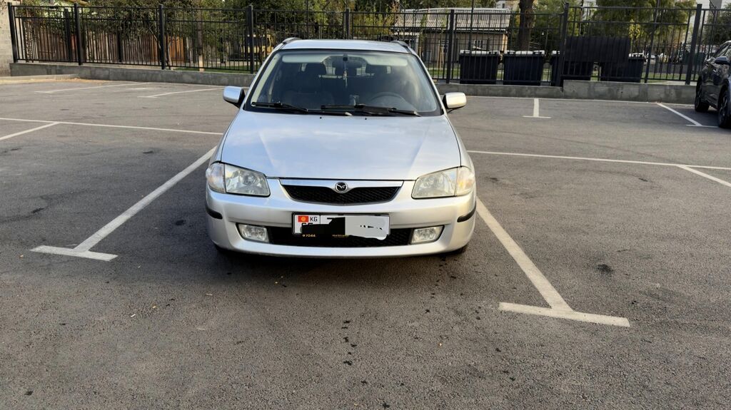 Mazda 323: 1999 г., 1.6 л, Механика, Бензин, Универсал: фото 2