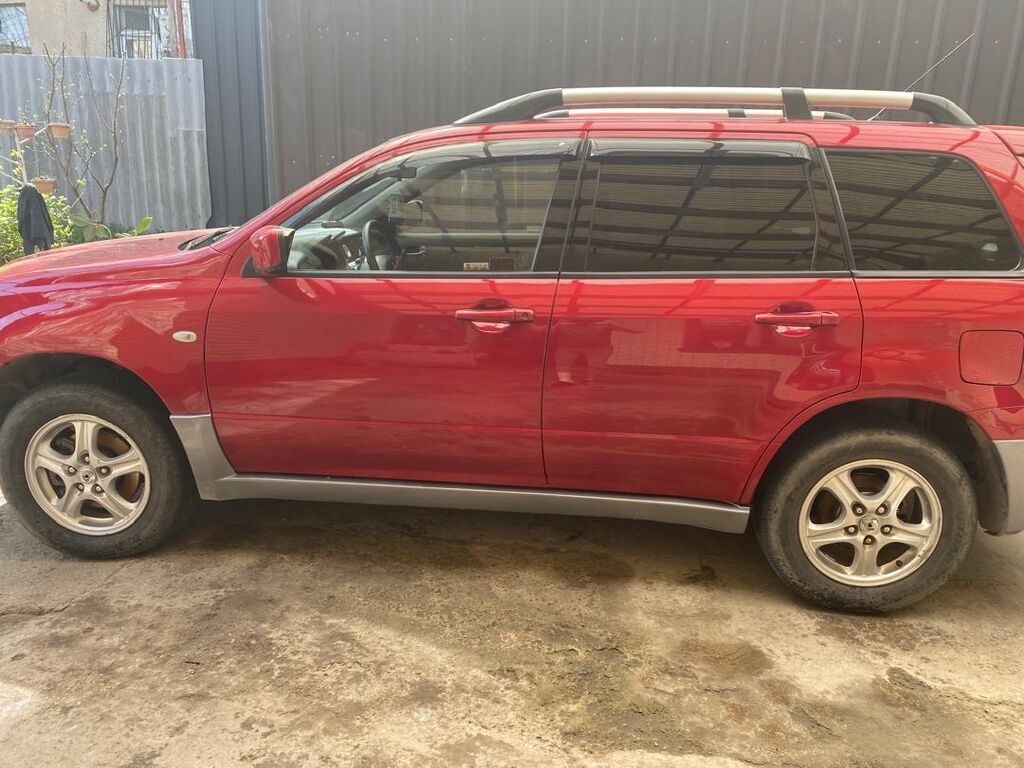 Mitsubishi Outlander: 2004 г., 2.4 л, Автомат, Газ, Универсал: фото 4