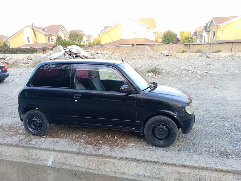 Daihatsu Cuore: 2001 г., 1 л, Механика, Бензин, Купе: фото 4