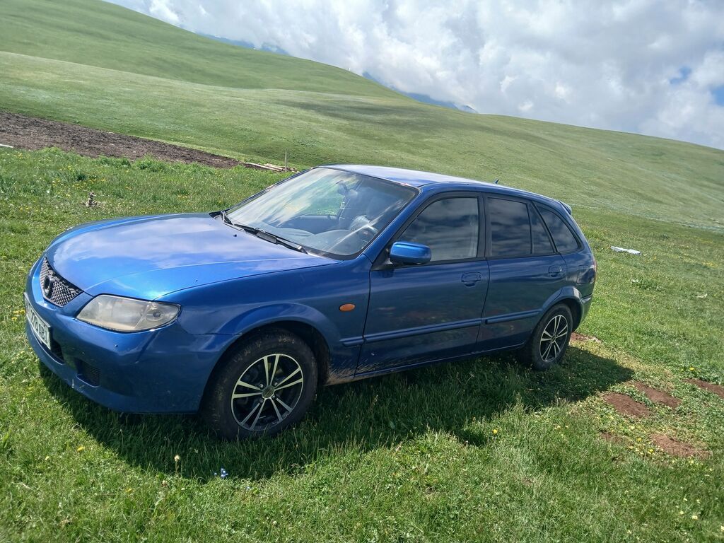Mazda 323: 2003 г., 1.6 л, Механика, Бензин, Седан: фото 3