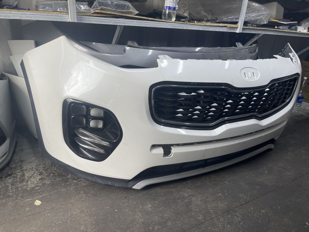Передний бампер в сборе для Kia Sportage (поколение с новой эмблемой)