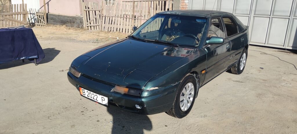 Mazda 323: 1994 г., 1.6 л, Купе — фото 2
