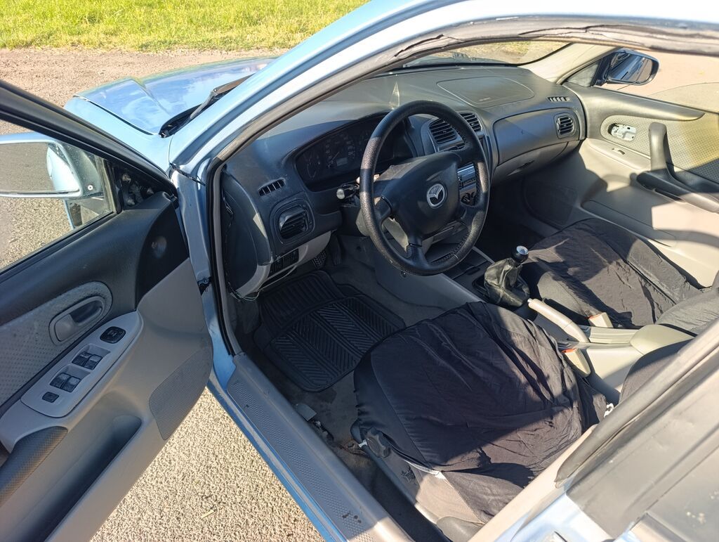 Mazda 323: 2003 г., 1.6 л, Механика, Бензин, Универсал: фото 7