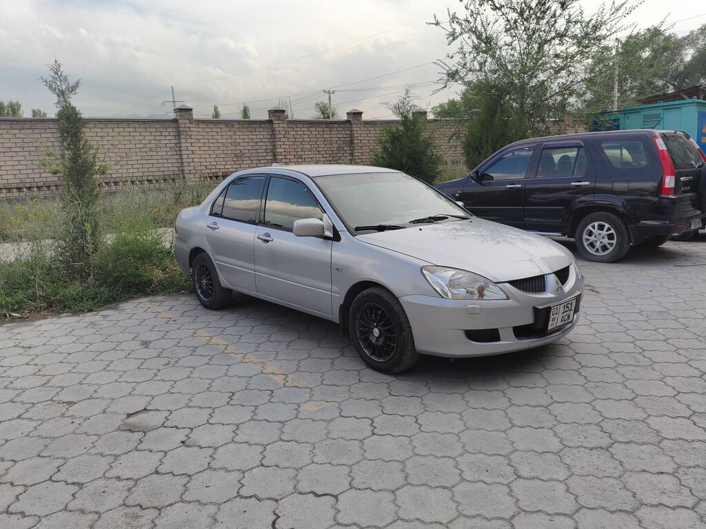 Mitsubishi Lancer: 2003 г., 1.6 л, Автомат, Газ, Седан — фото 3