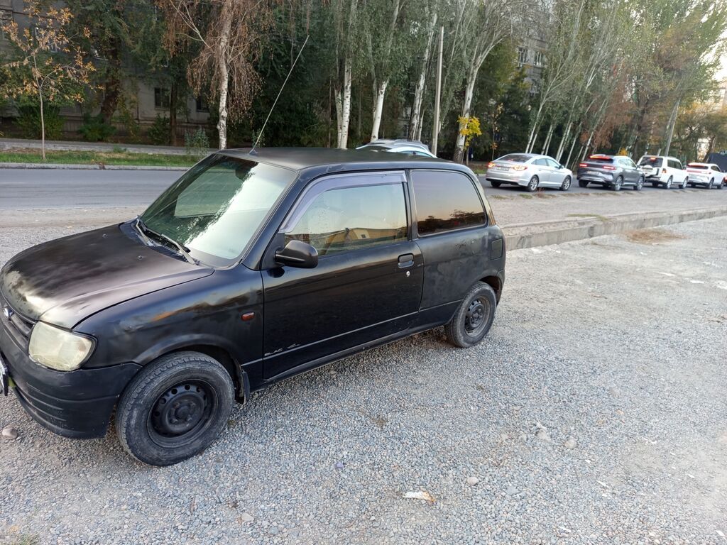 Daihatsu Cuore: 2001 г., 1 л, Механика, Бензин, Купе: фото 2