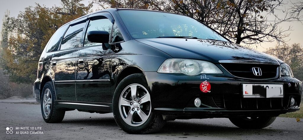 Хонда одиссей бишкек. Хонда Одиссей Абсолют 2003. Honda Odyssey 2002 2.3. Одиссей Абсолют 2002.