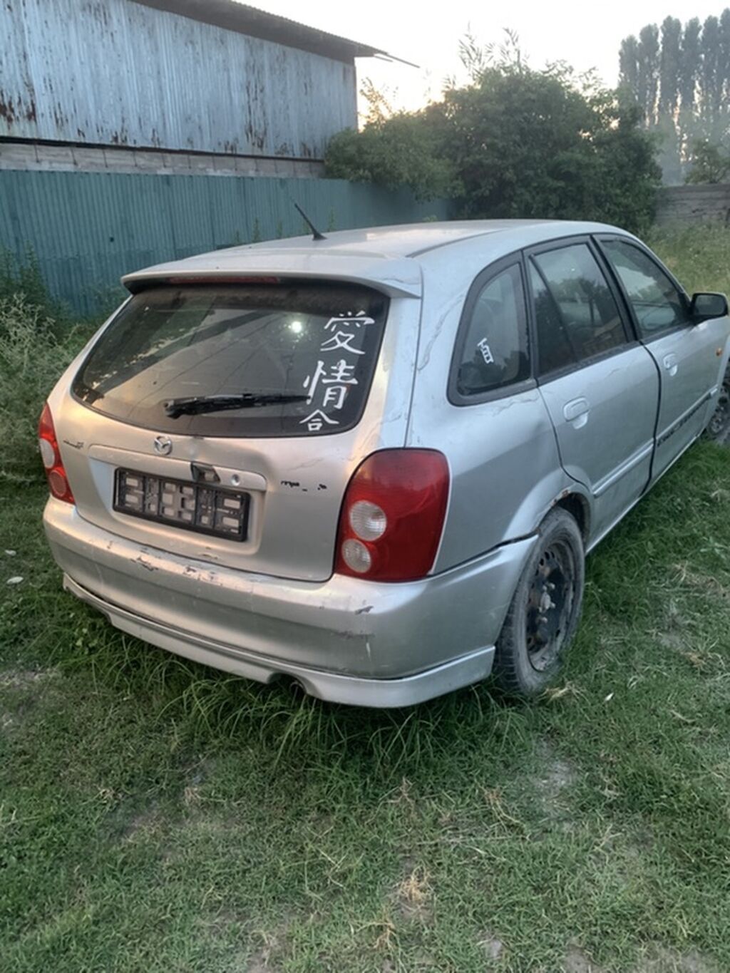 Mazda 323: 2003 г., 2 л, Механика, Бензин, Универсал — фото 3