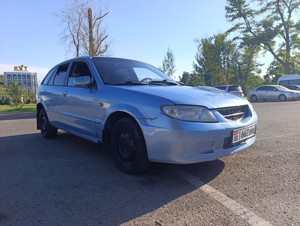 Mazda 323: 2003 г., 1.6 л, Механика, Бензин, Универсал: фото 2