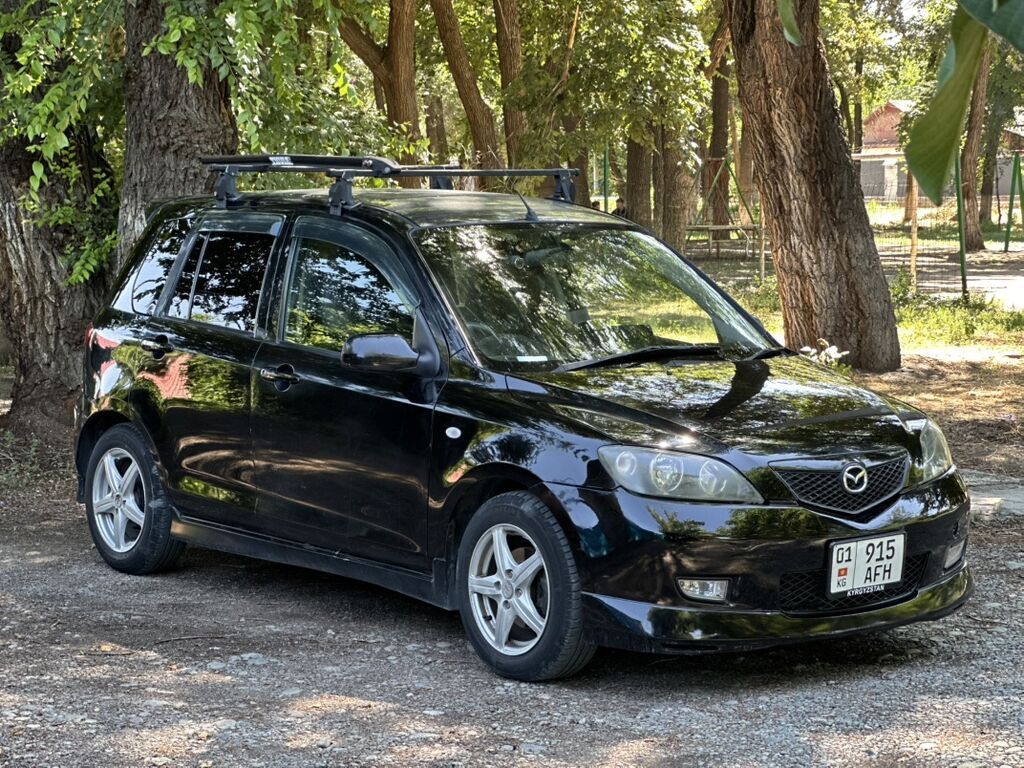 Mazda Demio: 2004 г., 1.5 л, Автомат, Бензин, Хэтчбэк — фото 2