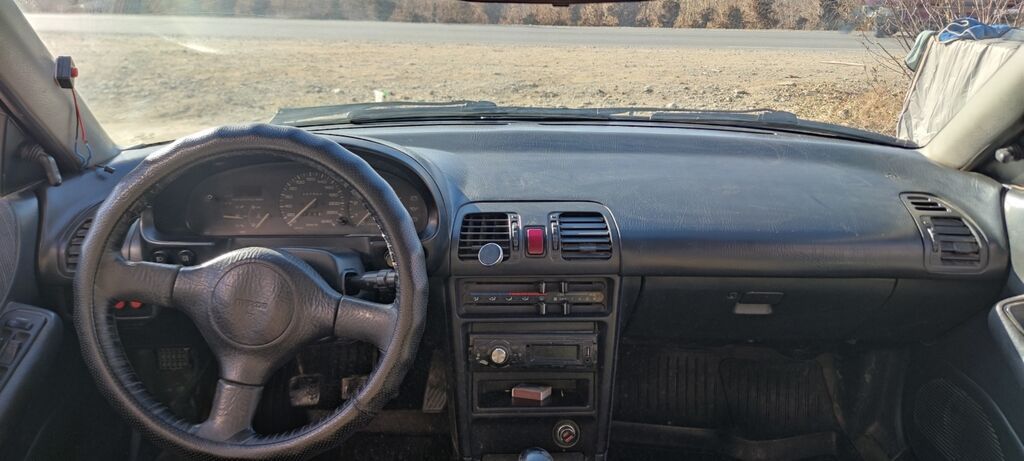 Mazda 323: 1994 г., 1.6 л, Купе — фото 6