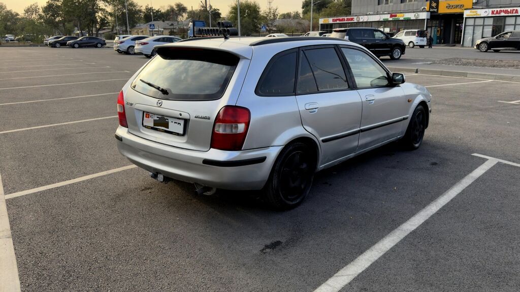 Mazda 323: 1999 г., 1.6 л, Механика, Бензин, Универсал: фото 5