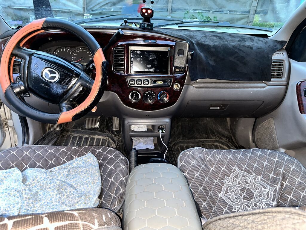 Mazda Tribute: 2001 г., 3 л, Автомат, Газ, Кроссовер: фото 4