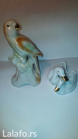 Ogledala, satovi i dekoracija: Komplet figura od porcelana. Cena je za obe. Visina papagaja 15 cm. na lalafo.rs Komplet figura od porcelana. Cena je za obe. Visina papagaja 15 cm. - Novi Sad