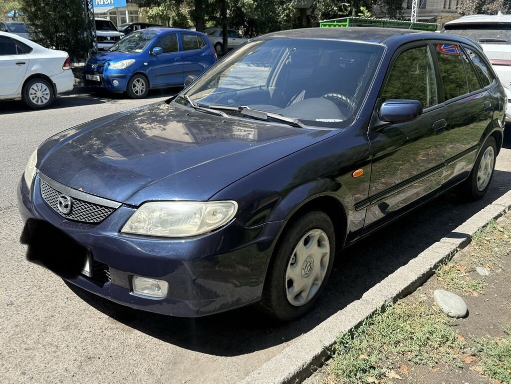 Mazda 323: 2002 г., 1.6 л, Механика, Бензин, Хэтчбэк: фото 2