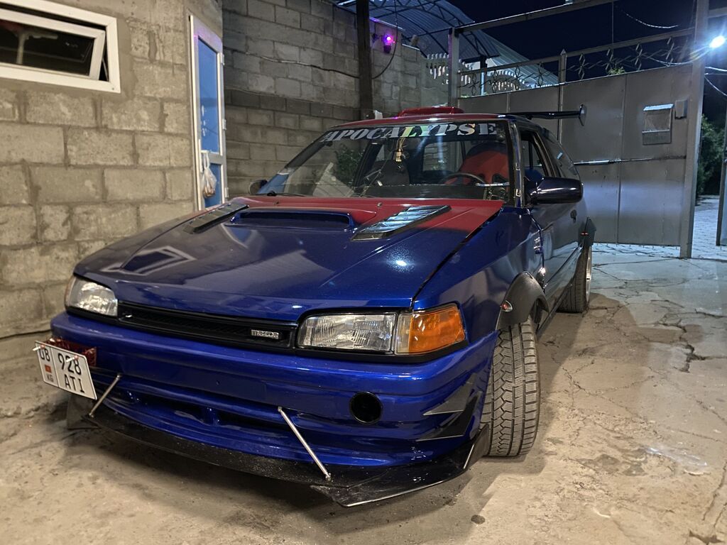 Mazda 323 1991 г., тюнинг, хэтчбек: фото 5
