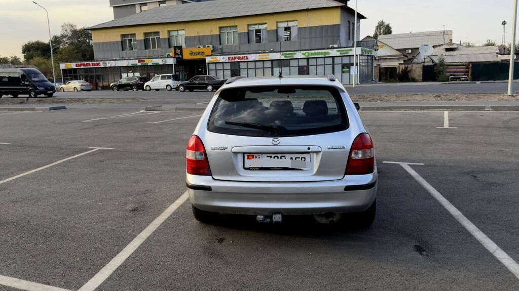 Mazda 323: 1999 г., 1.6 л, Механика, Бензин, Универсал: фото 6