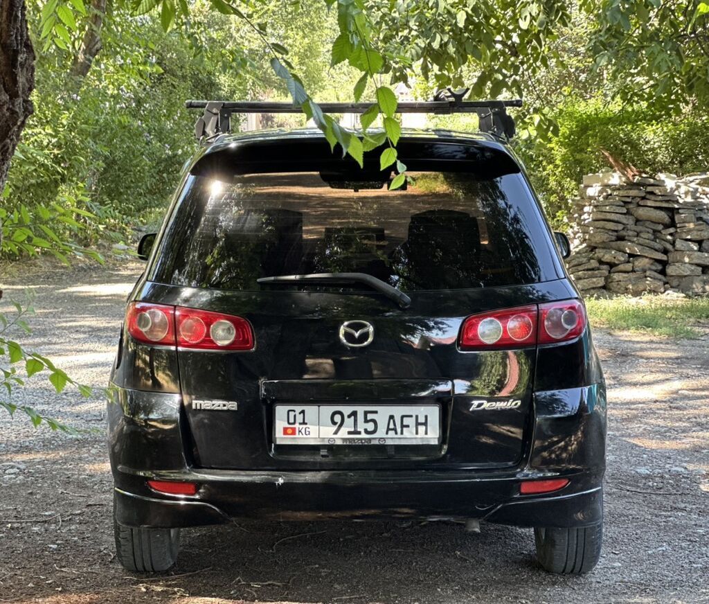 Mazda Demio: 2004 г., 1.5 л, Автомат, Бензин, Хэтчбэк — фото 3