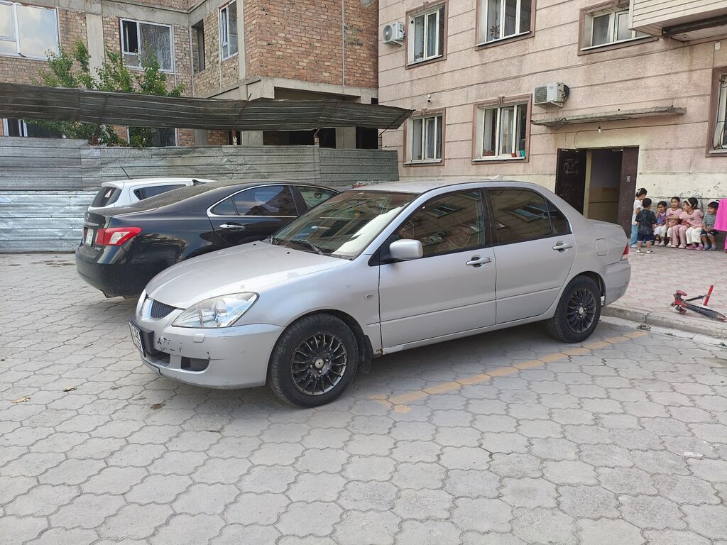 Mitsubishi Lancer: 2003 г., 1.6 л, Автомат, Газ, Седан — фото 4