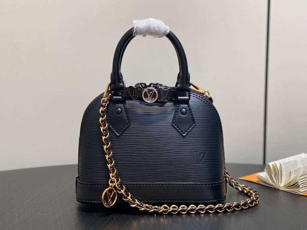Torbe: Louis Vuitton Alma BB, crna mini torba od Epi kože. - Materijal