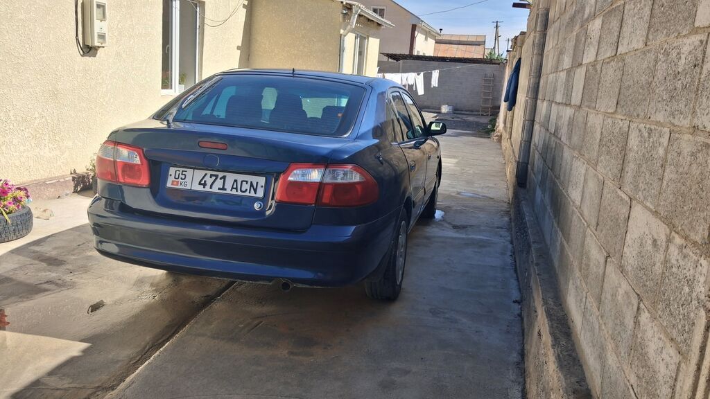 Mazda Capella: 2002 г., Механика, Бензин, Седан: фото 3
