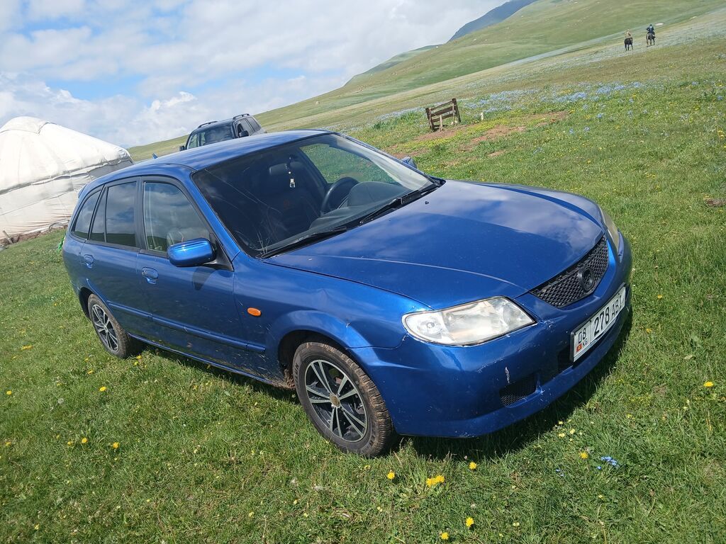 Mazda 323: 2003 г., 1.6 л, Механика, Бензин, Седан: фото 4