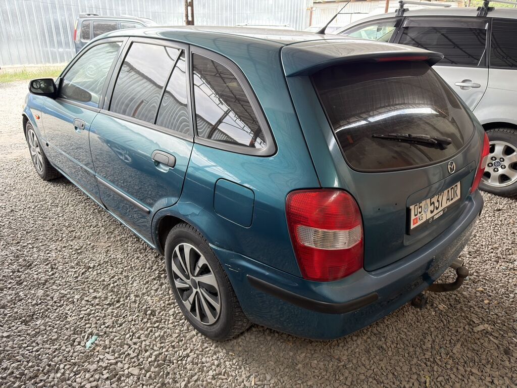 Mazda 323: 1999 г., 1.5 л, Механика, Бензин, Универсал: фото 4