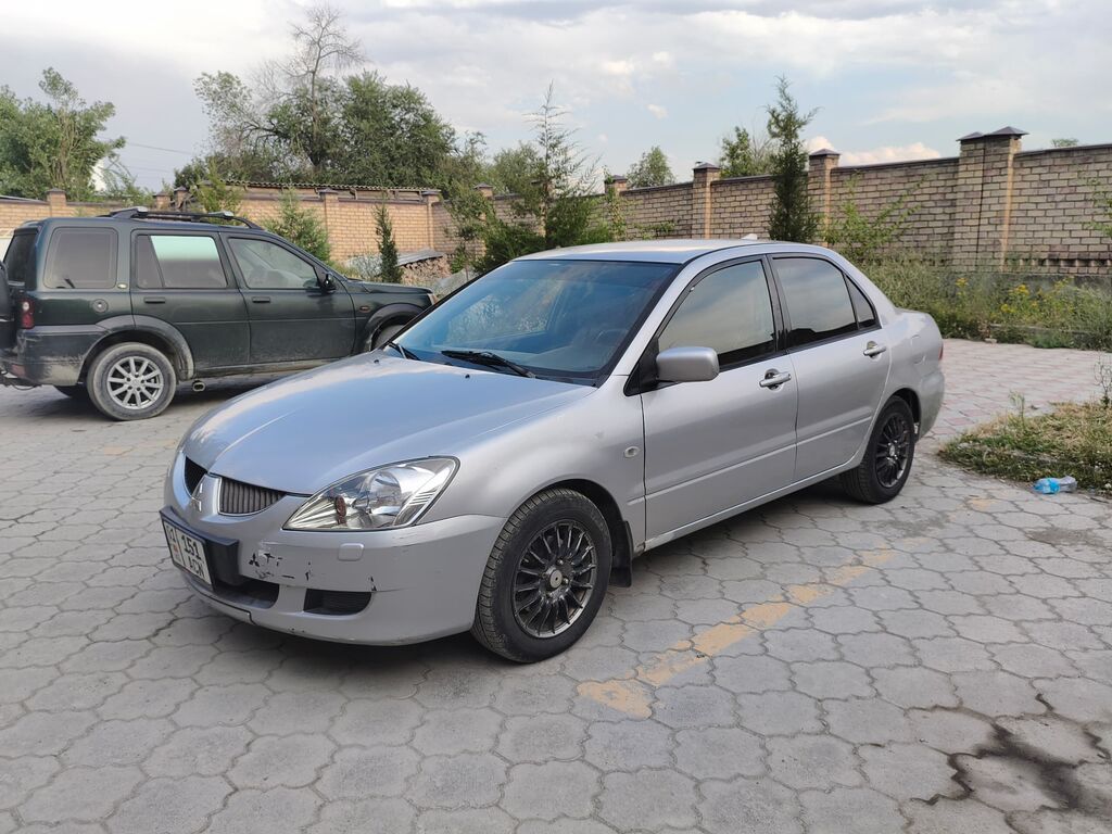 Mitsubishi Lancer: 2003 г., 1.6 л, Автомат, Газ, Седан — фото 2
